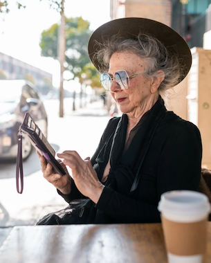 Old lady checking her cell phone